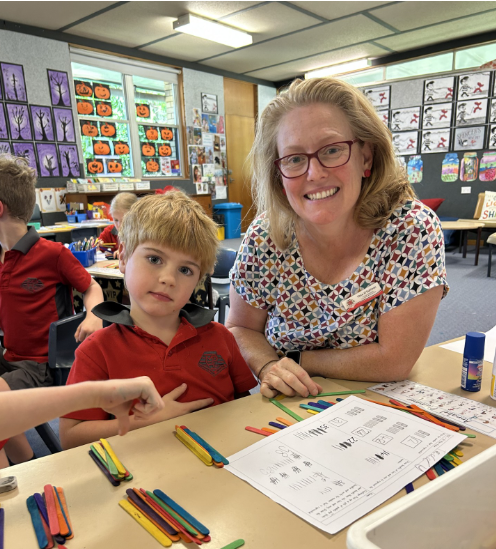 Photo of Mrs O'Sullivan working with a student.