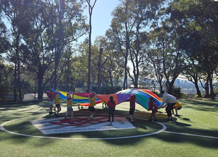 Photo of students playing in the school playground.