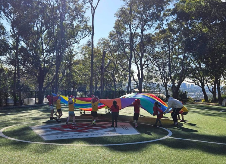 Photo of students playing in school grounds.